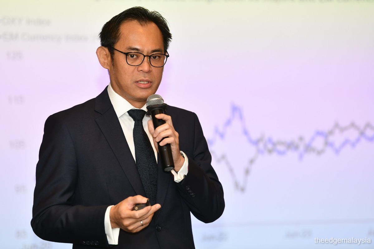 standard-chartered-sees-us-dollar-staying-weak-for-12-months-raises