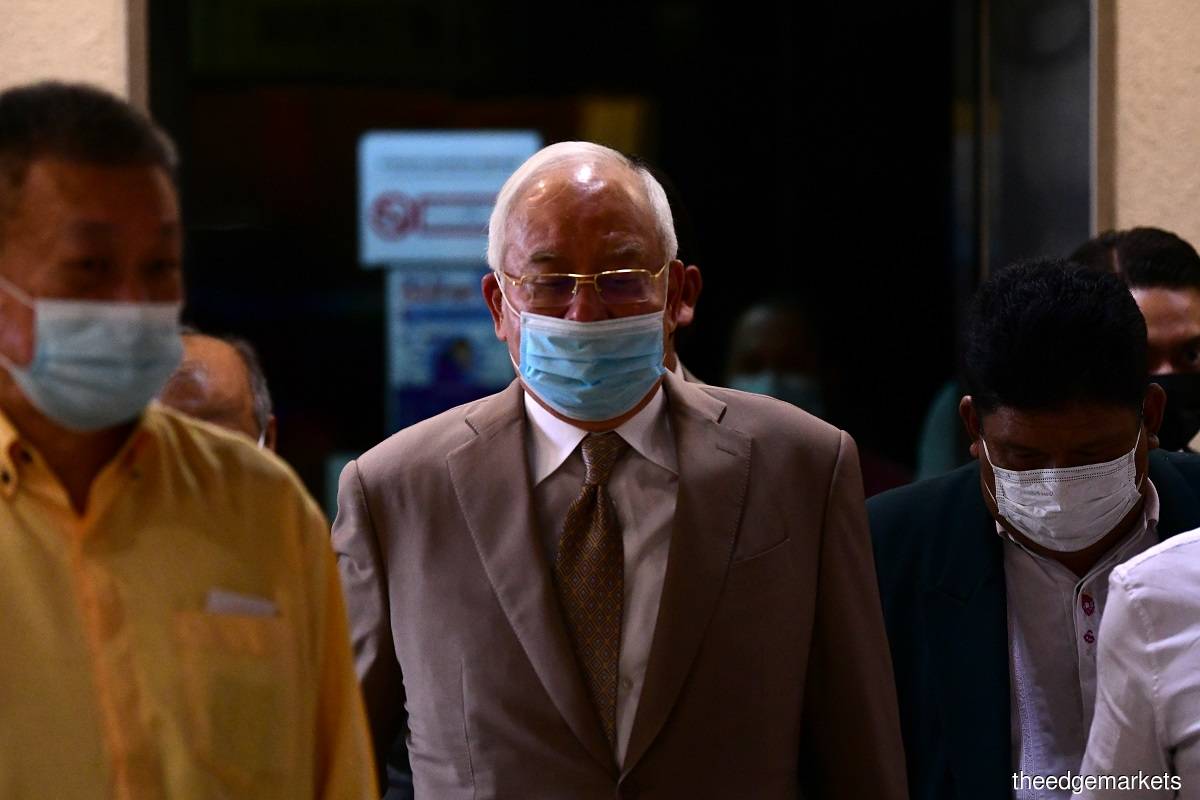 On June 12, Najib (centre) filed an application to recuse Sri Ram from leading the prosecution in the case. (Photo by Patrick Goh/The Edge)