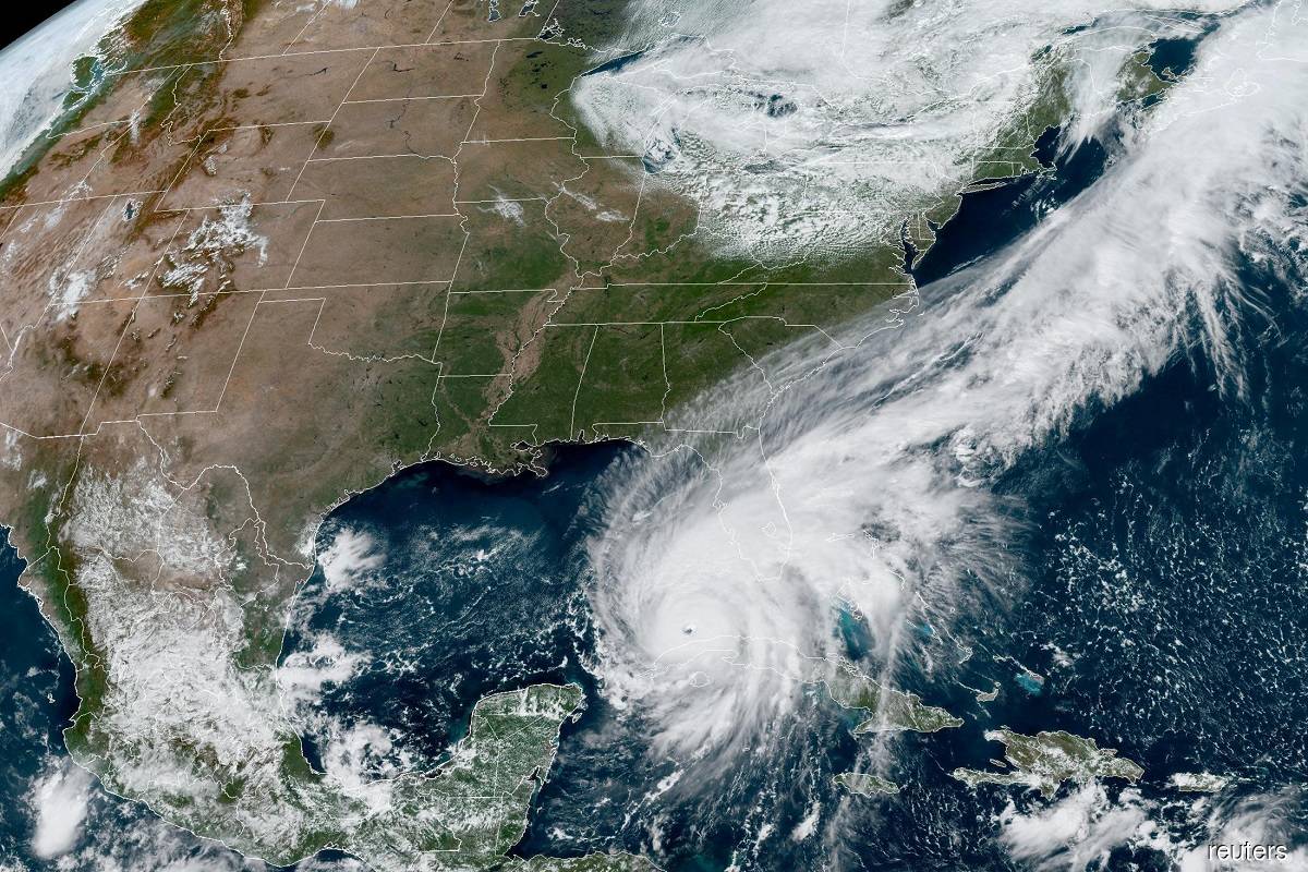 Hurricane Ian makes its way to Florida's west coast after passing Cuba in a composite image from the National Oceanic and Atmospheric Administration (NOAA) GOES-East weather satellite Sept 27, 2022.