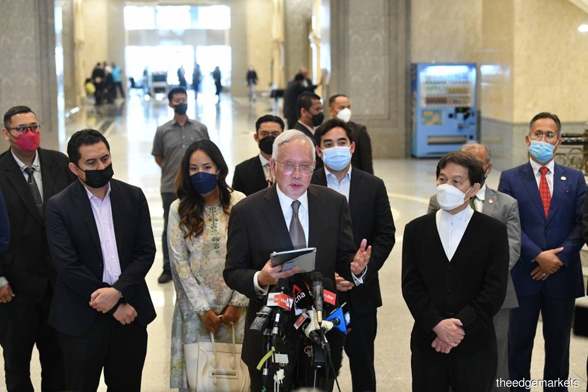 Datuk Seri Mohd Najib Razak (front, centre), with his lawyer Datuk Hisyam Teh Poh Teik (front, right) at a press conference after Najib's SRC final appeal trial on Thursday Aug 18, 2022. (Photo by Mohd Suhaimi Mohamed Yusuf/The Edge)