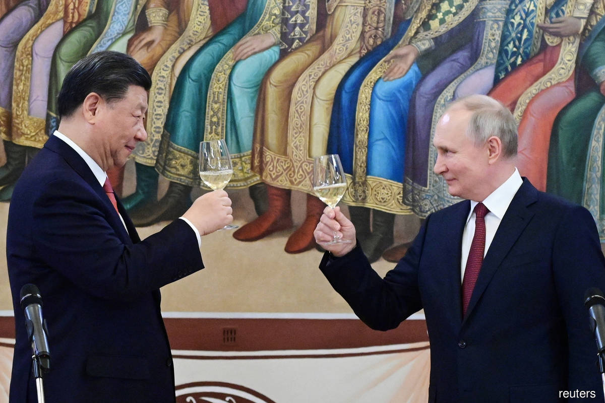 Russian President Vladimir Putin (right) with Chinese leader Xi Jinping on Tuesday (March 21).
