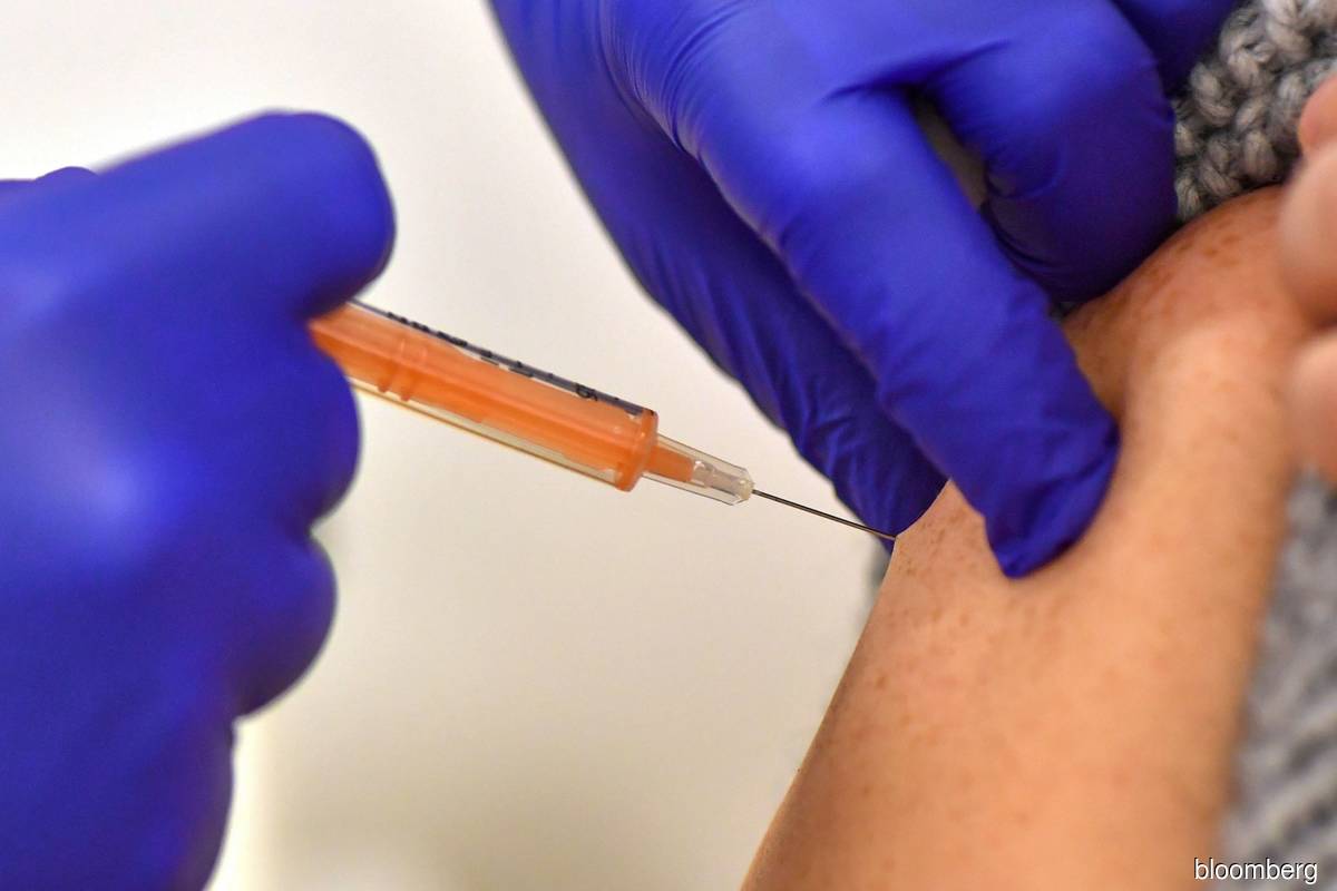 UK speeds vaccine program to offer all adults shot by July 31