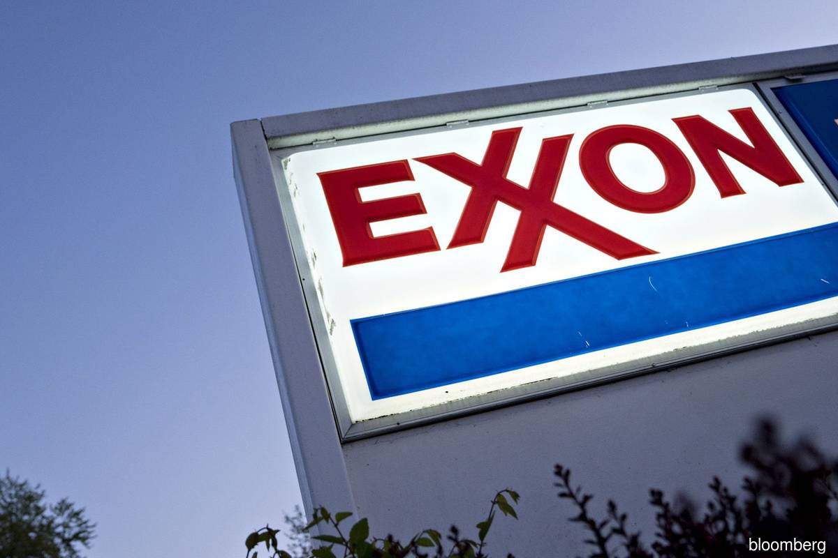 Exxon board adds activist after attacks on returns, climate