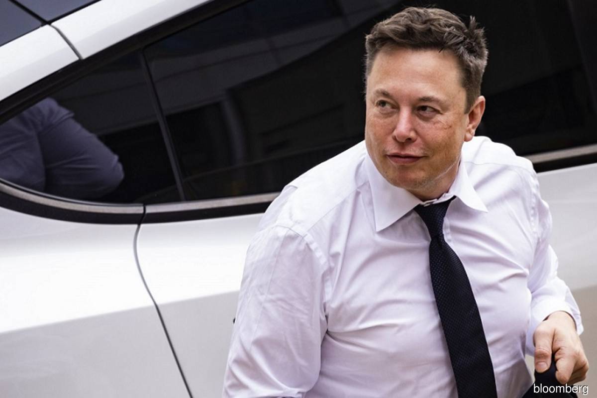 Elon Musk arrives at court during the SolarCity trial in Wilmington, Delaware on July 13, 2021.