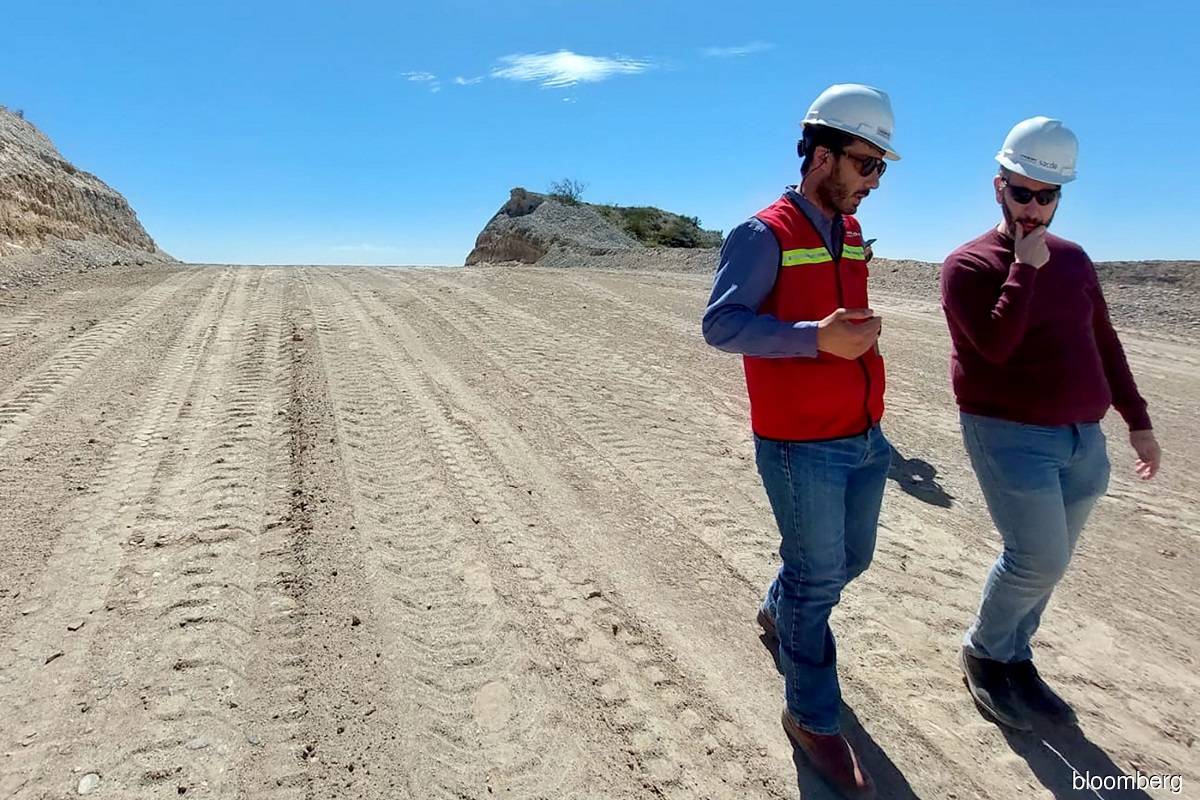Jose Ibarra, a construction manager, speaks to a member of the media on the Nestor Kirchner pipeline route during a site visit. (Photo credit: Jonathan Gilbert/Bloomberg)