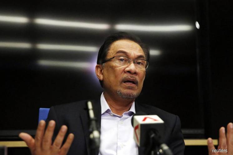 Bids to strike out Anwar’s name in two suits dismissed