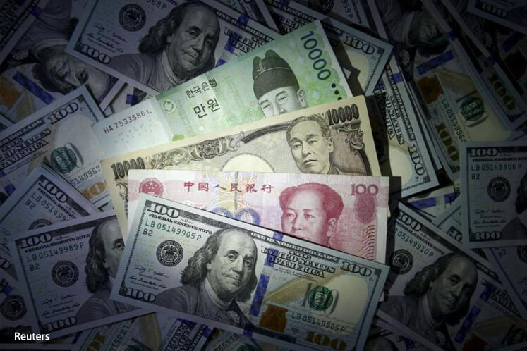 Asian currencies slip as upbeat US data bolsters dollar