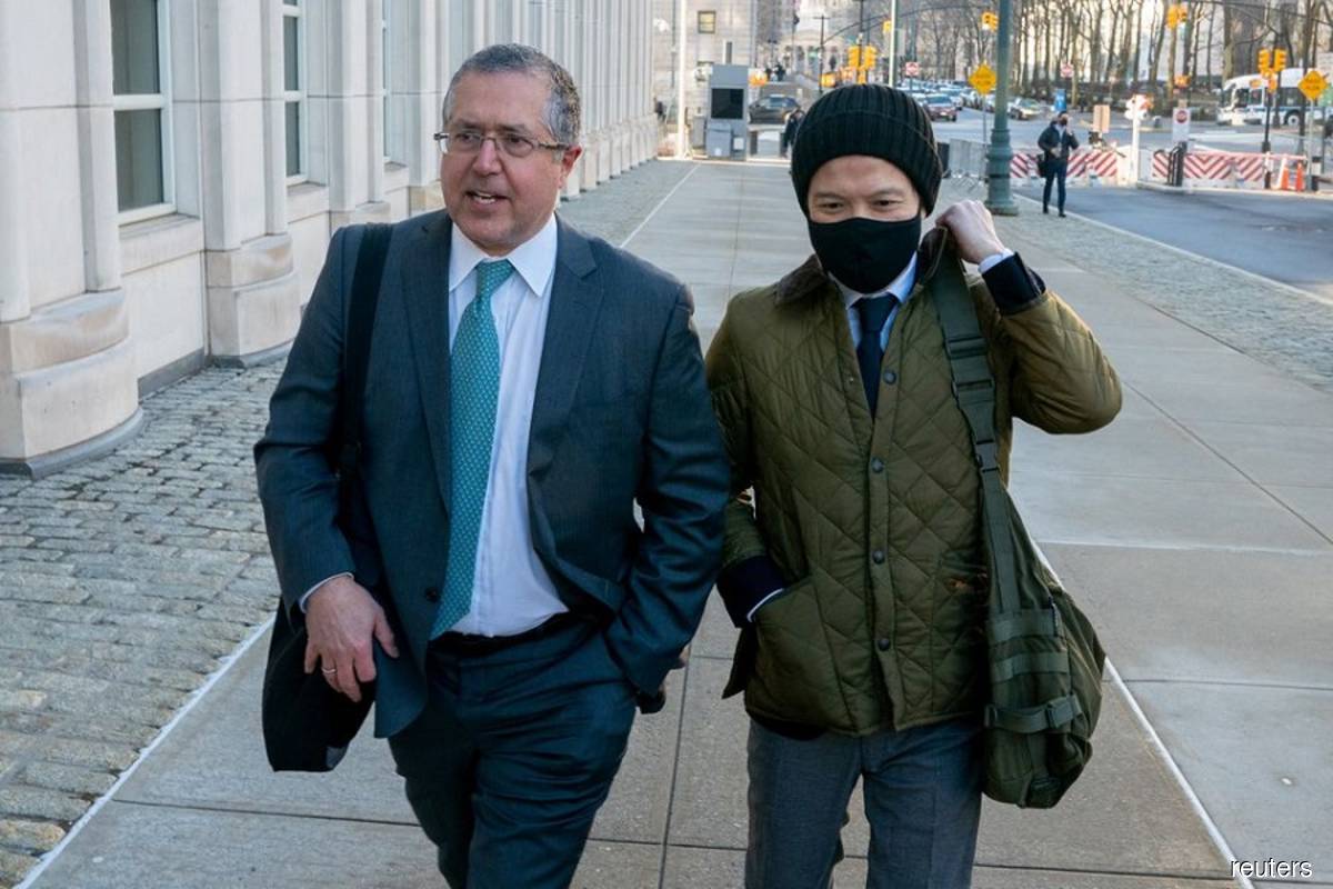 Attorney Marc Agnifilo (left) and ex-Goldman banker Roger Ng arriving at the Federal Court for the jury selection process for Ng's trial in New York, the US on Feb 8, 2022. (Reuters file photo by David Dee Delgado)