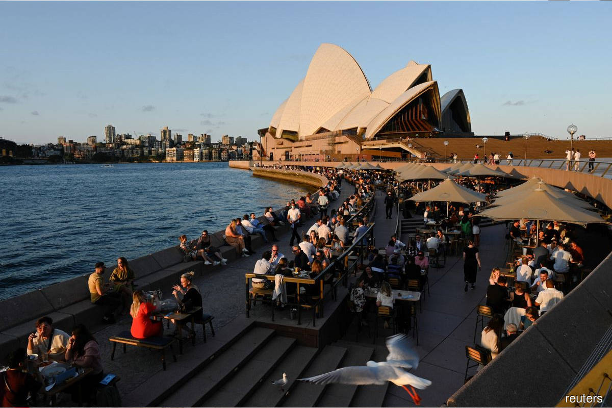 Australia begins vaccine booster rollout as more curbs ease in Sydney - The Edge Markets MY