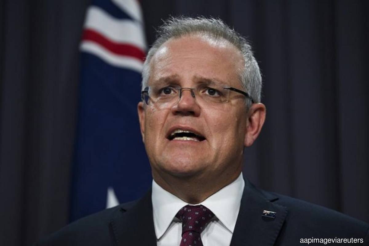 Australia PM Morrison vows to cap tax revenue if re-elected
