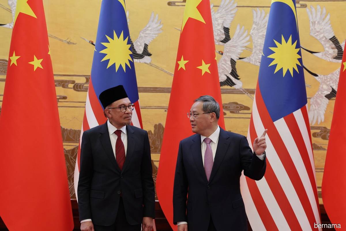 Malaysian Prime Minister Datuk Seri Anwar Ibrahim (left), seen with China's Prime Minister Li Qiang at the Great Hall of the People in Beijing, China on Saturday, April 1, 2023.
