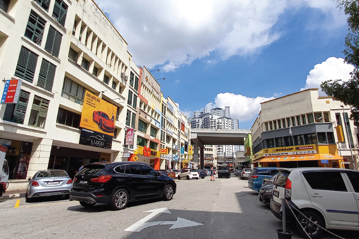 The commercial area is surrounded by high-rise buildings, with the sizeable population supporting the businesses there (Photo by Patrick Goh/The Edge)
