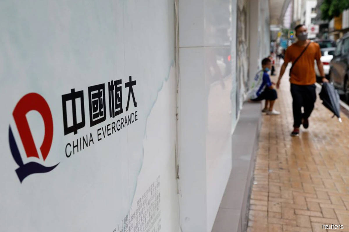 China property shares fall even as PBOC says Evergrande woes manageable