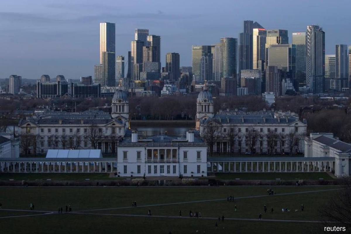 City of London Canary Wharf is seen beyond the Maritime Museum from Greenwich Park, London, Britain on Dec 27, 2020. (Reuters filepix by Simon Dawson)