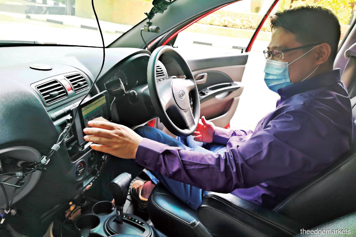 Project research assistant Teoh Hock Chye explaining how the AVMS operates during a live demonstration