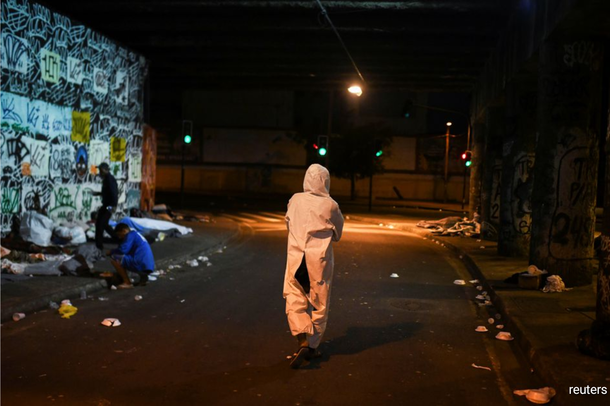 Marco Antonio, 21, a homeless man, is pictured as NGO doAcao distributes food and blankets to the homeless while an unusual cold hits Rio de Janeiro, Brazil, July 29, 2021.