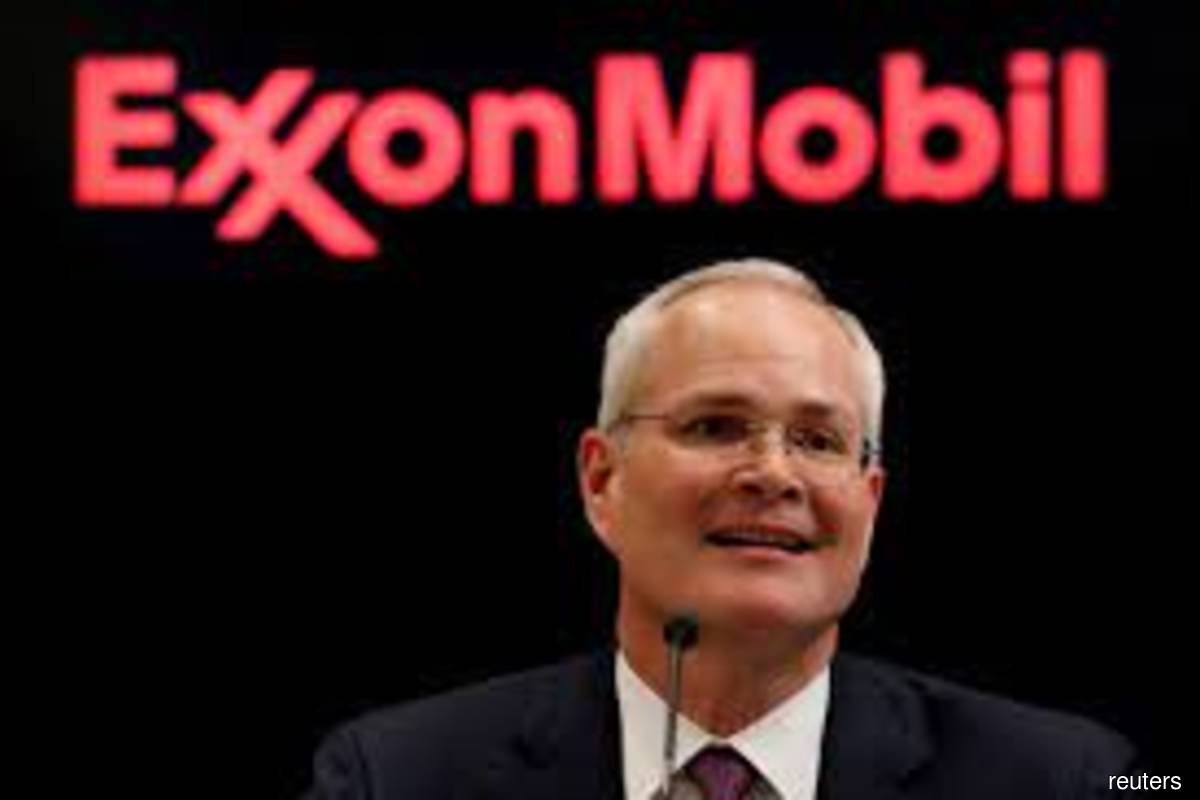 Exxon is "accelerating investment in our advantaged projects to sustainably grow shareholder value," Chief Executive Darren Woods said on Wednesday, Dec 1, 2021. (Reuters filepix by Brendan McDermid)