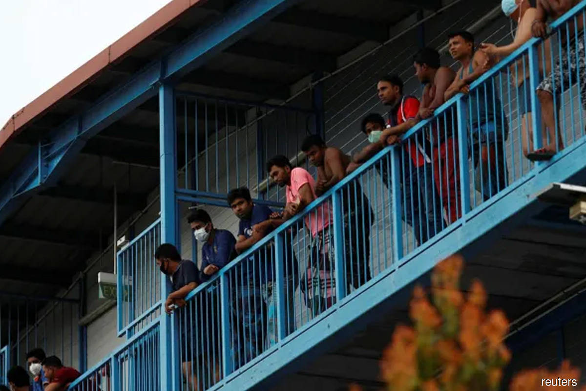 Singapore quarantines about 1,200 migrant workers, probes reinfections