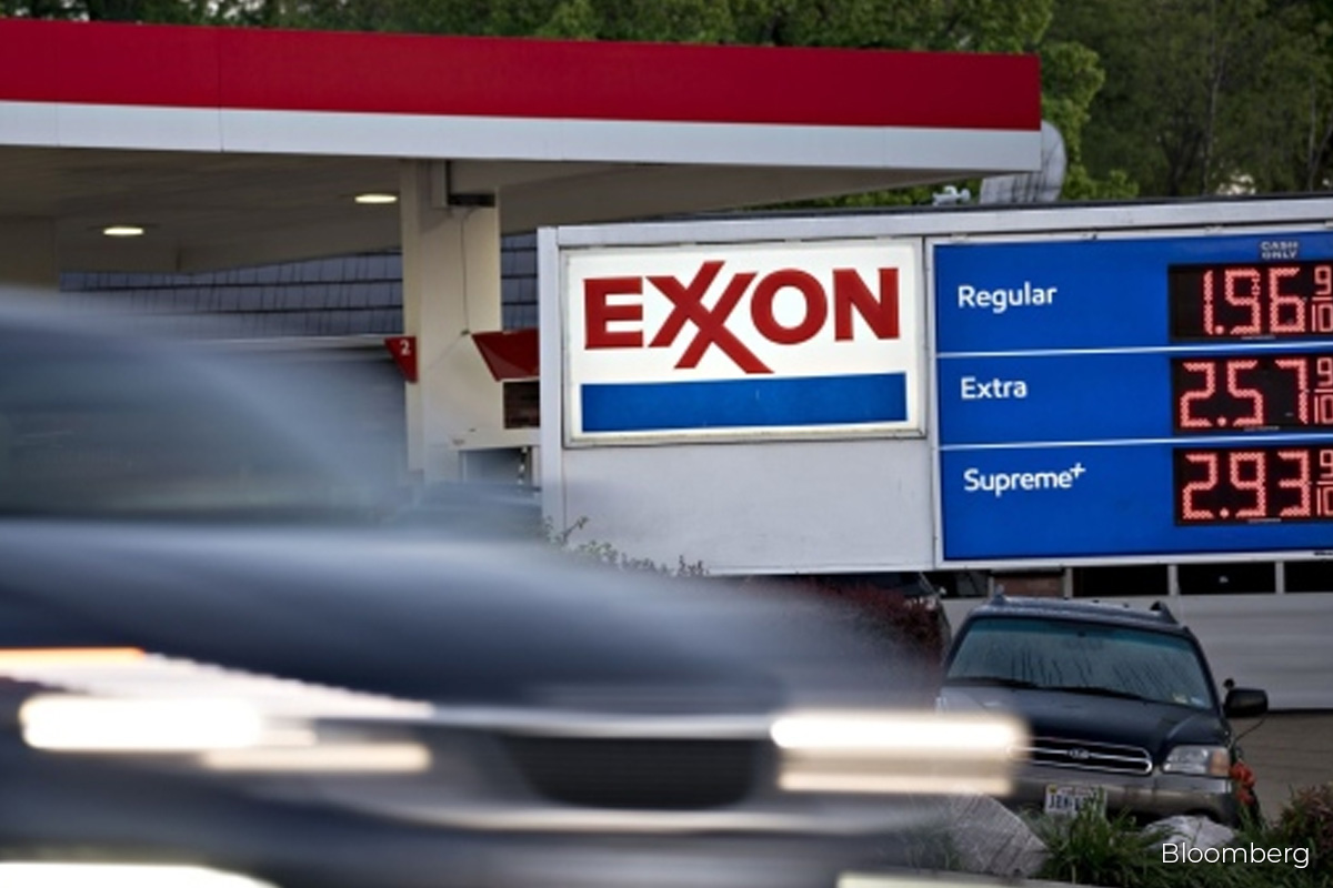 Exxon to lay off employees, citing tough markets, The