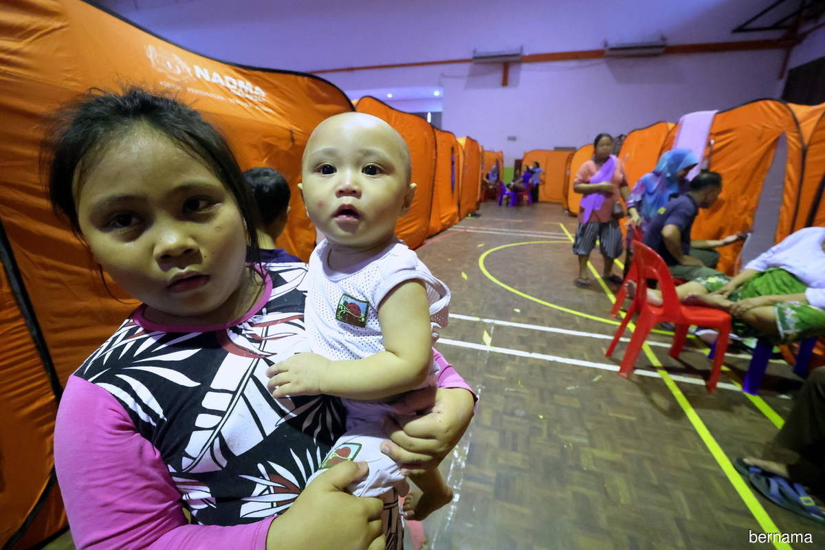 Young victims of floods at a relief centre in Kota Marudu, Sabah on Thursday (Jan 26).