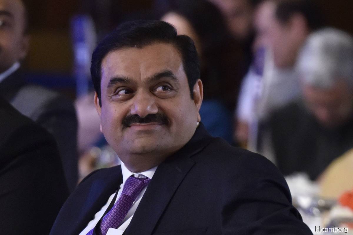 India's Adani shares slump after freeze placed on foreign ...