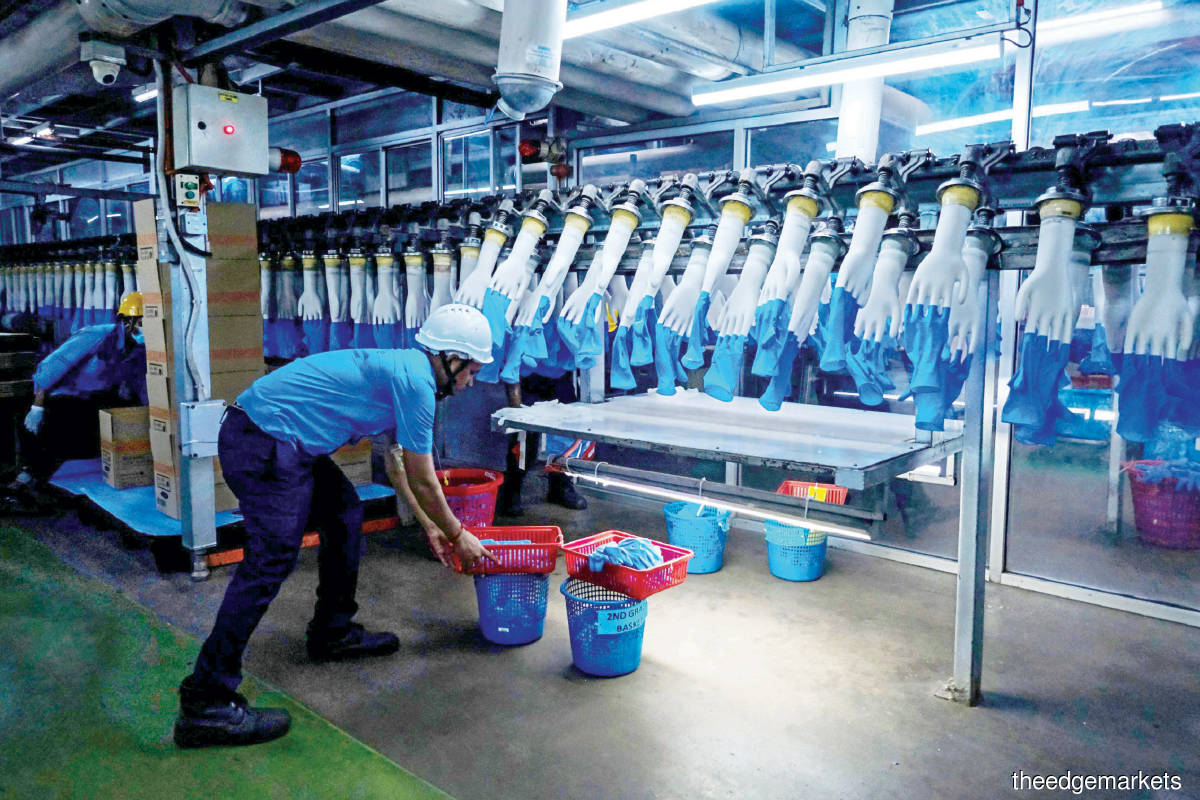 Among the four biggest rubber glove makers on Bursa Malaysia, the market seems to view Kossan and Supermax more negatively than Top Glove and Hartalega. (Photo by Bloomberg)