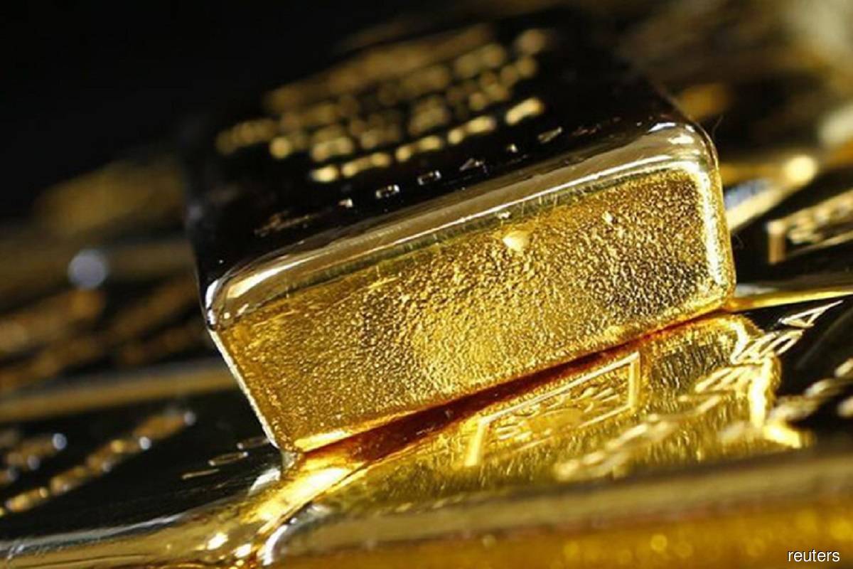 Gold ticks higher on softer US dollar; Fed's Powell in focus