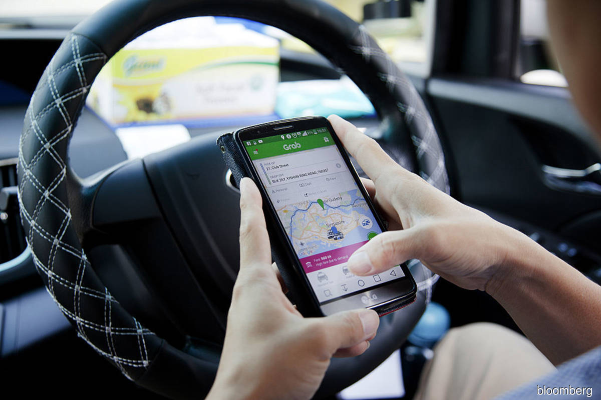 Grab drivers, delivery riders' complaints get Muhyiddin's attention