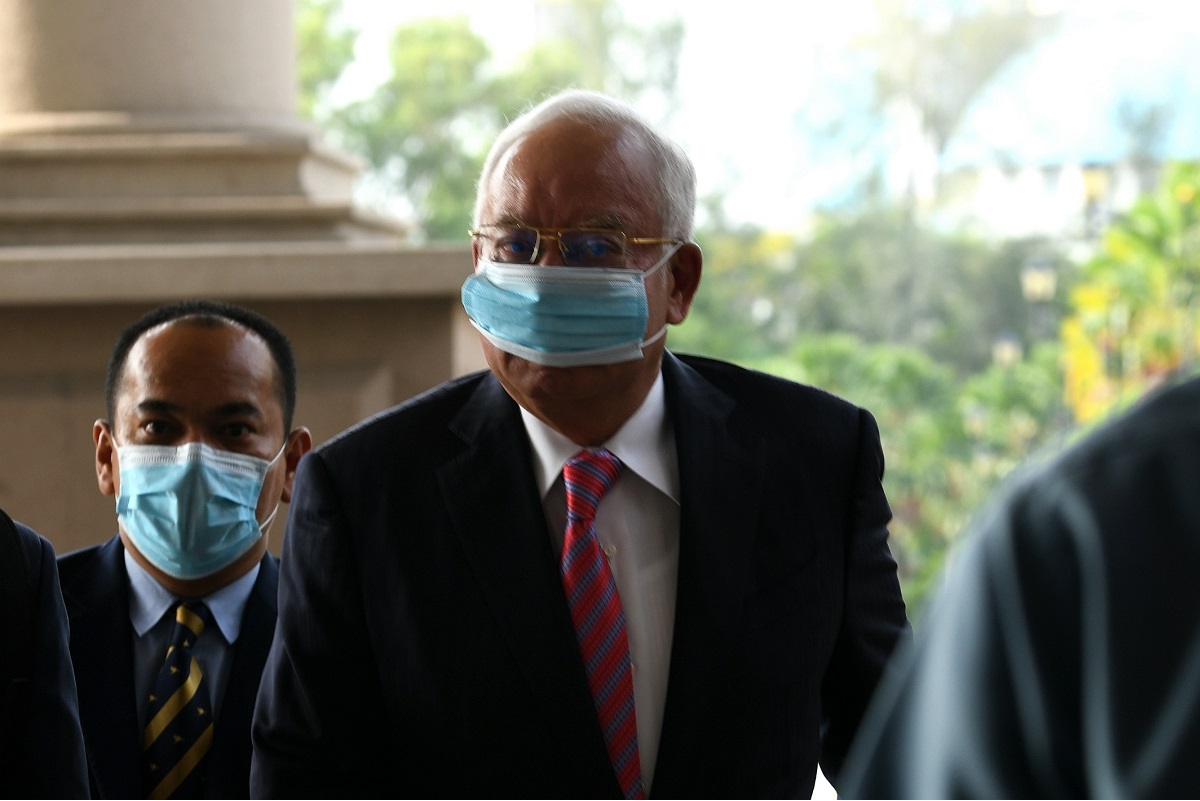 Najib faces four counts of power abuse to enrich himself with RM2.3 billion from 1MDB, and 21 counts of laundering the same amount. (Photo by Shahrin Yahya/The Edge)