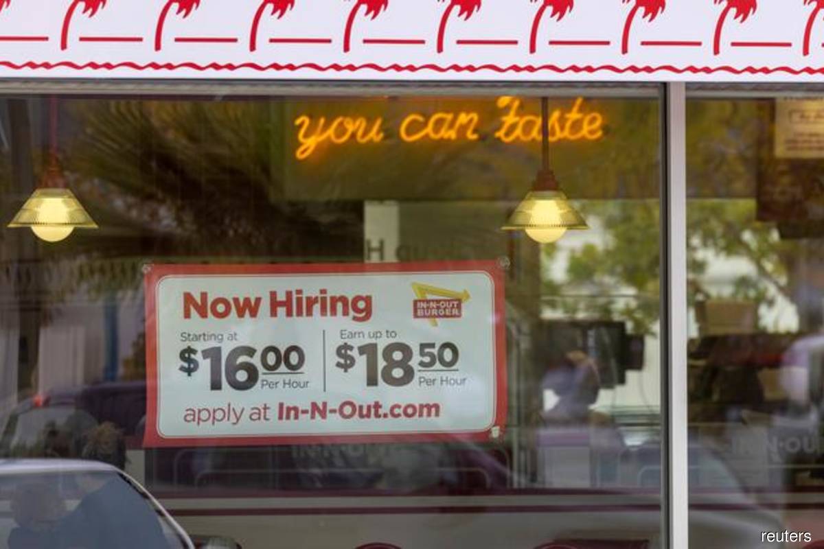 US companies hire more workers; signs labour crunch may be easing