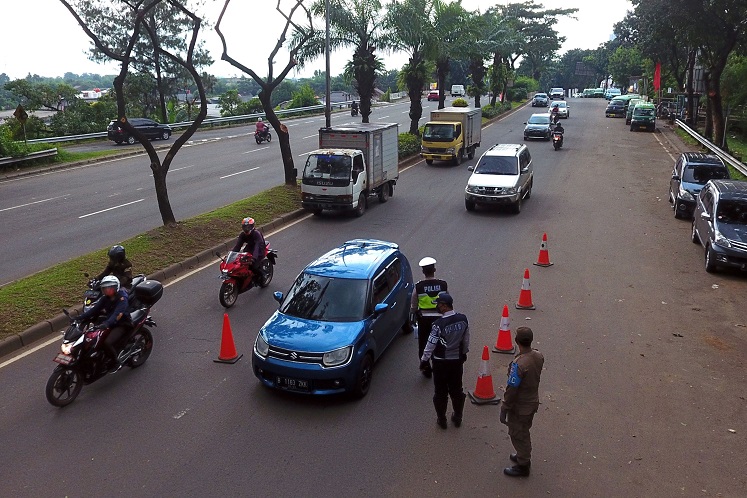 Indonesia reports record daily surge in Covid-19 cases 