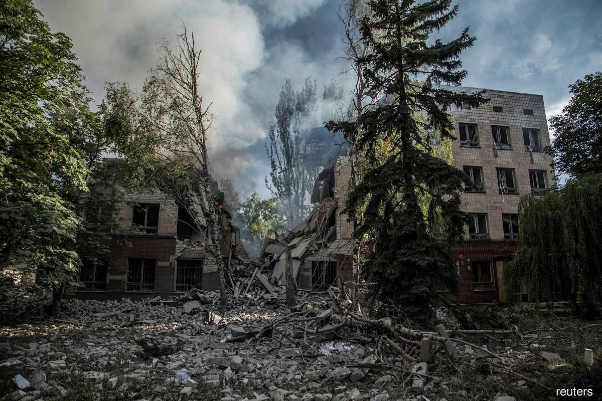 Smoke rises over the remains of a building destroyed by a military strike, as Russia's attack on Ukraine continues, in Lysychansk, Luhansk region, Ukraine June 17, 2022.