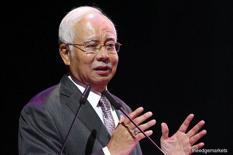 Malaysia’s Prime Minister Najib says markets to decide on currency