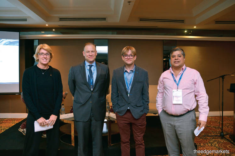 (From left) Sandy Baggett, counsel for Freshfields Bruckhaus Deringer; Dougherty; Mark Smalley, co-founder and CEO of Neuroware. io; and Bedi