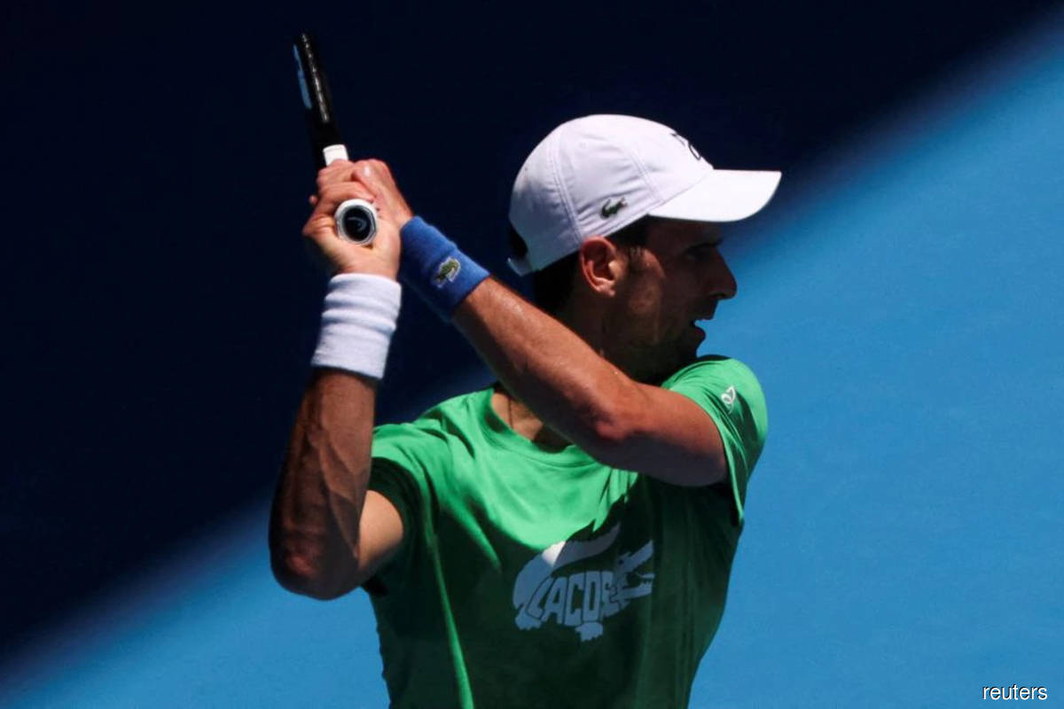 Serbian tennis player Novak Djokovic practises at Melbourne Park as questions remain over the legal battle regarding his visa to play in the Australian Open in Melbourne, Australia, Jan 13, 2022.