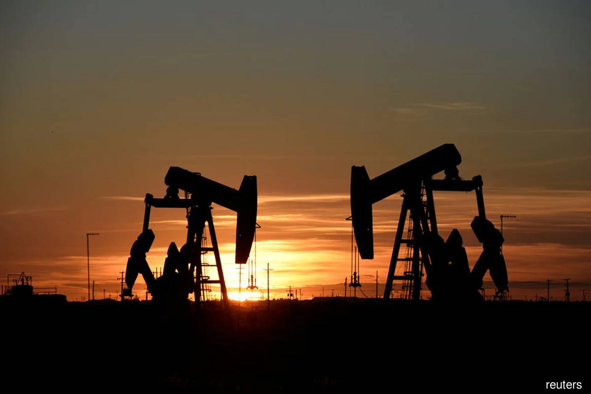 Oil slides on strong dollar and weaker demand outlook