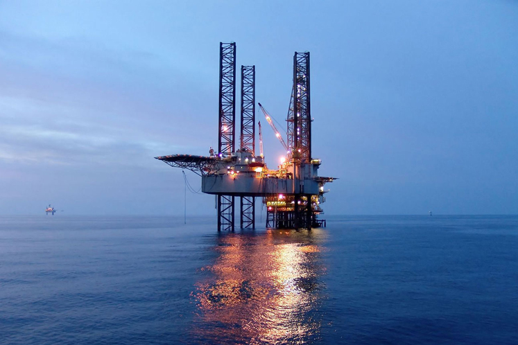 Oil jumps 3 pct on big U.S. crude draw, Iran sanctions