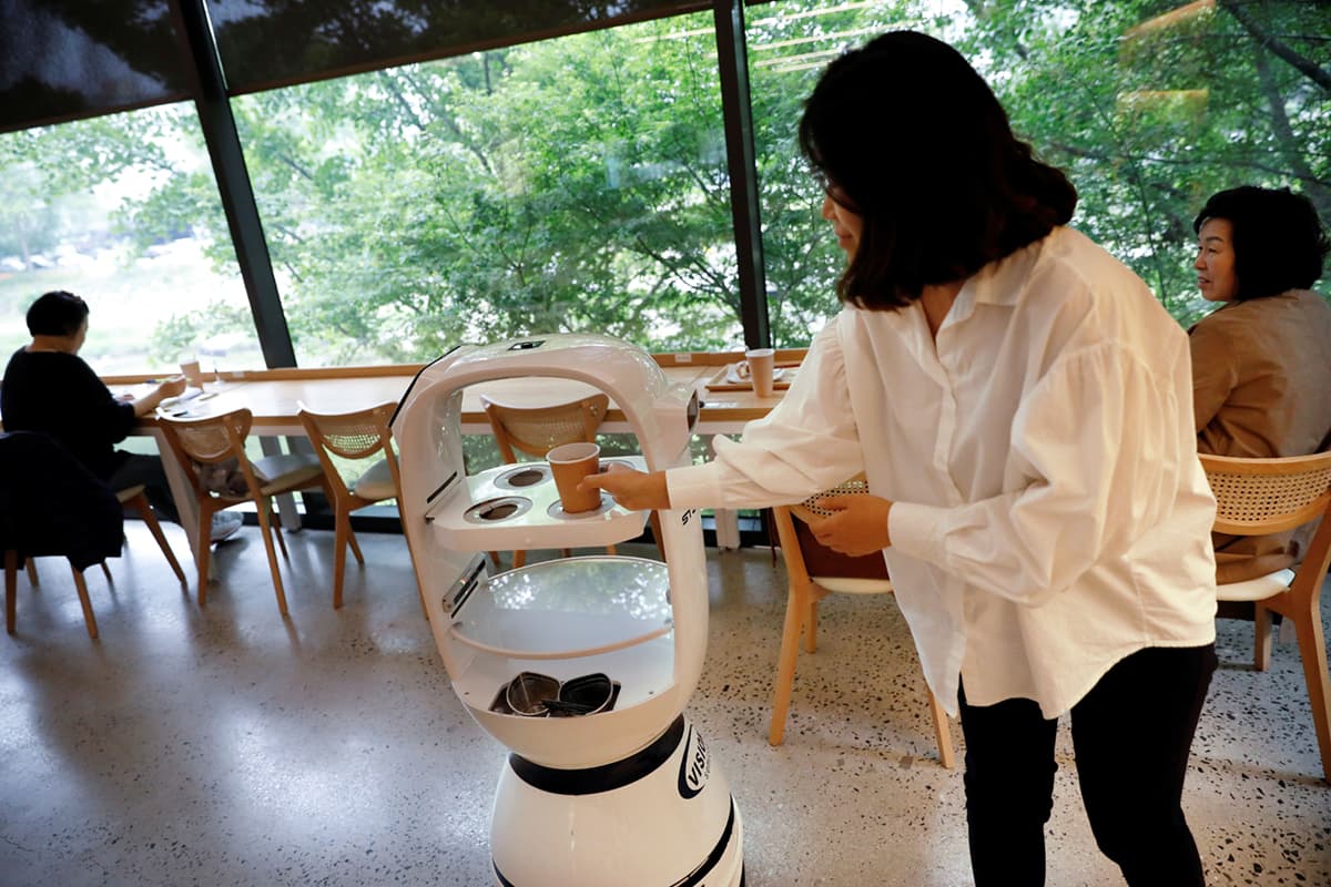 Coffee made and served by robots in South Korea. Photo by Reuters