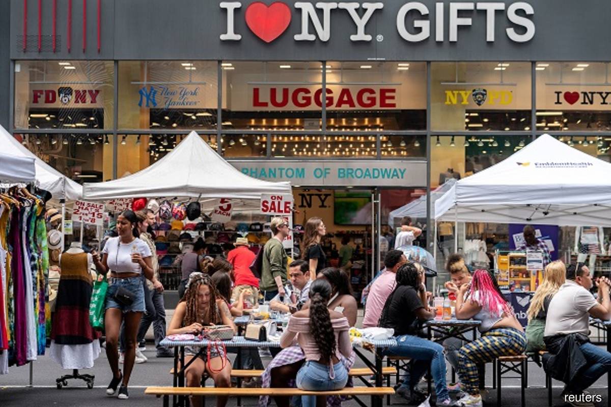People shop at a street fair near Times Square in New York City, US on July 11, 2021. (Photo by Jeenah Moon/Reuters filepix)