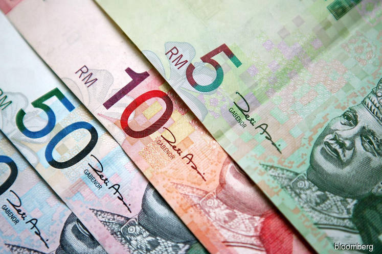Ringgit snaps three-day drop before output data