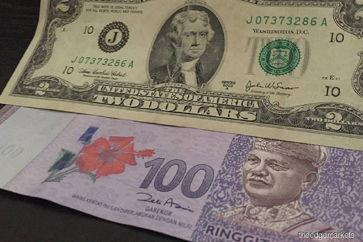 Ringgit opens slightly lower against US dollar  KLSE Screener