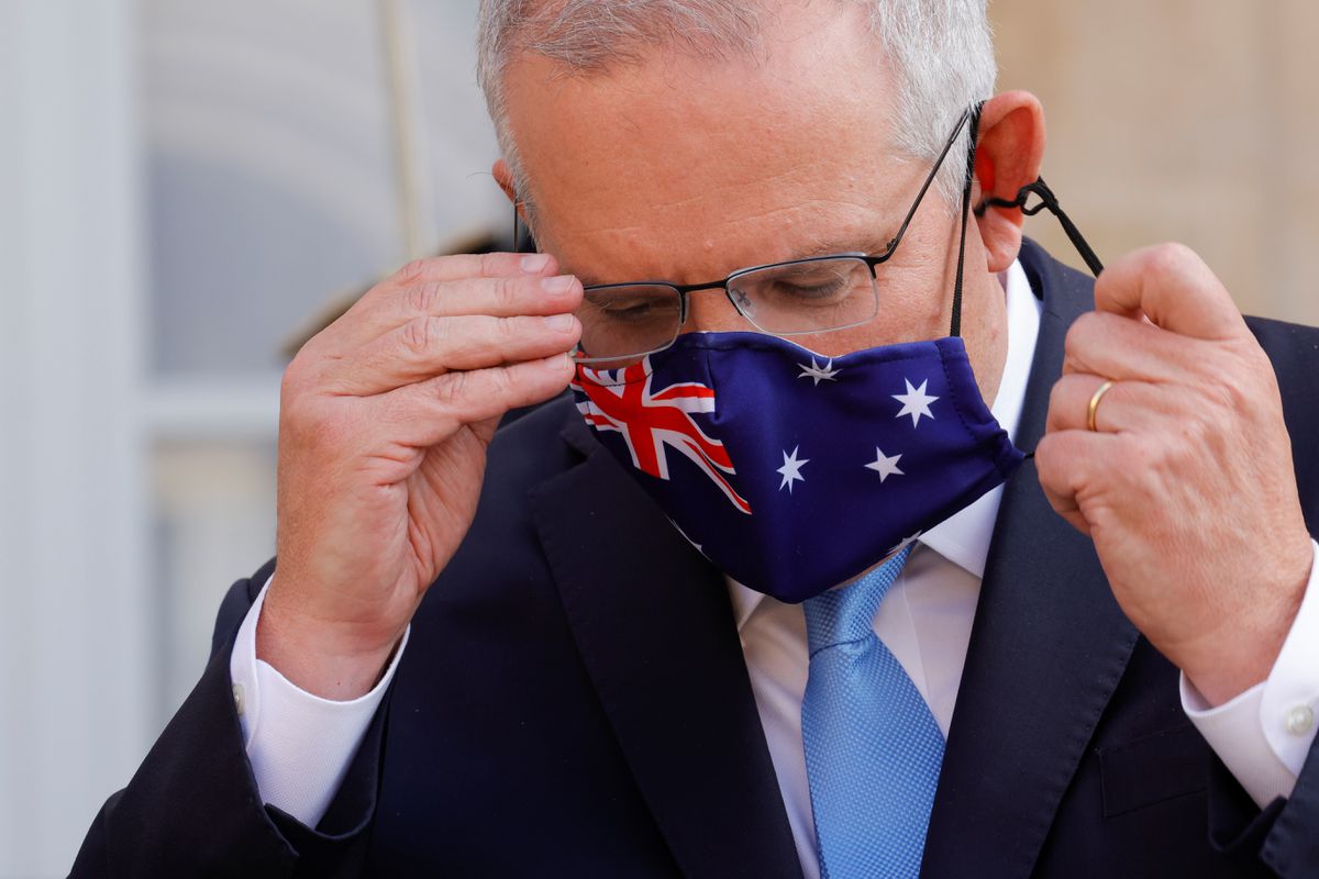Australian PM apologises for Covid-19 vaccine delays as cases spike