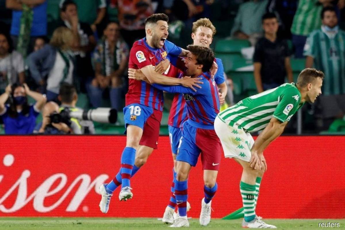 Barca secures Champions League spot with 2-1 Betis win