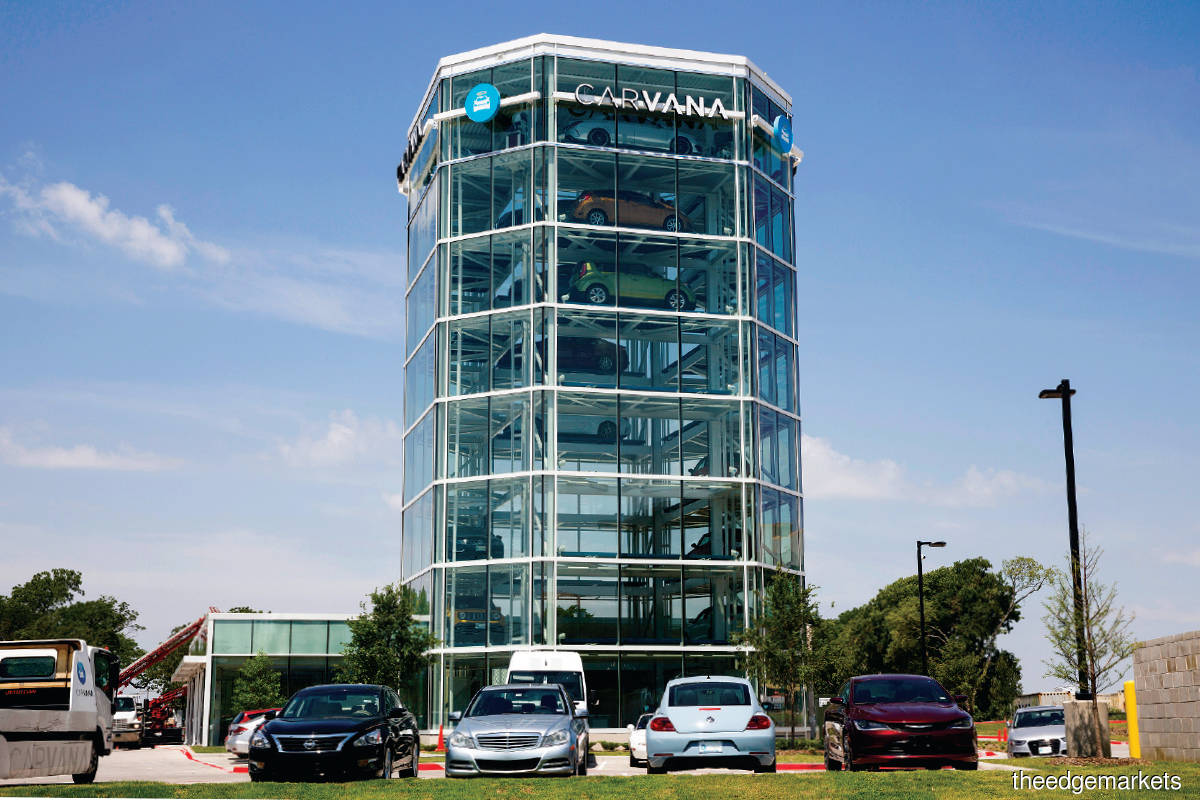 One of Carvana’s 33 multi-storey glass-tower car vending machines designed to dispatch cars like Coke cans. (Photo by Bloomberg)