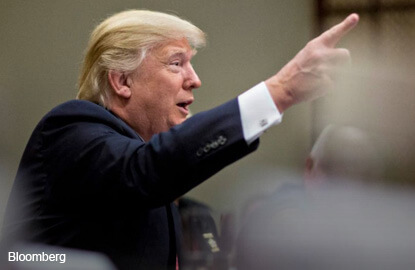 Facing test of resolve, Trump pushes ahead with North Korea review
