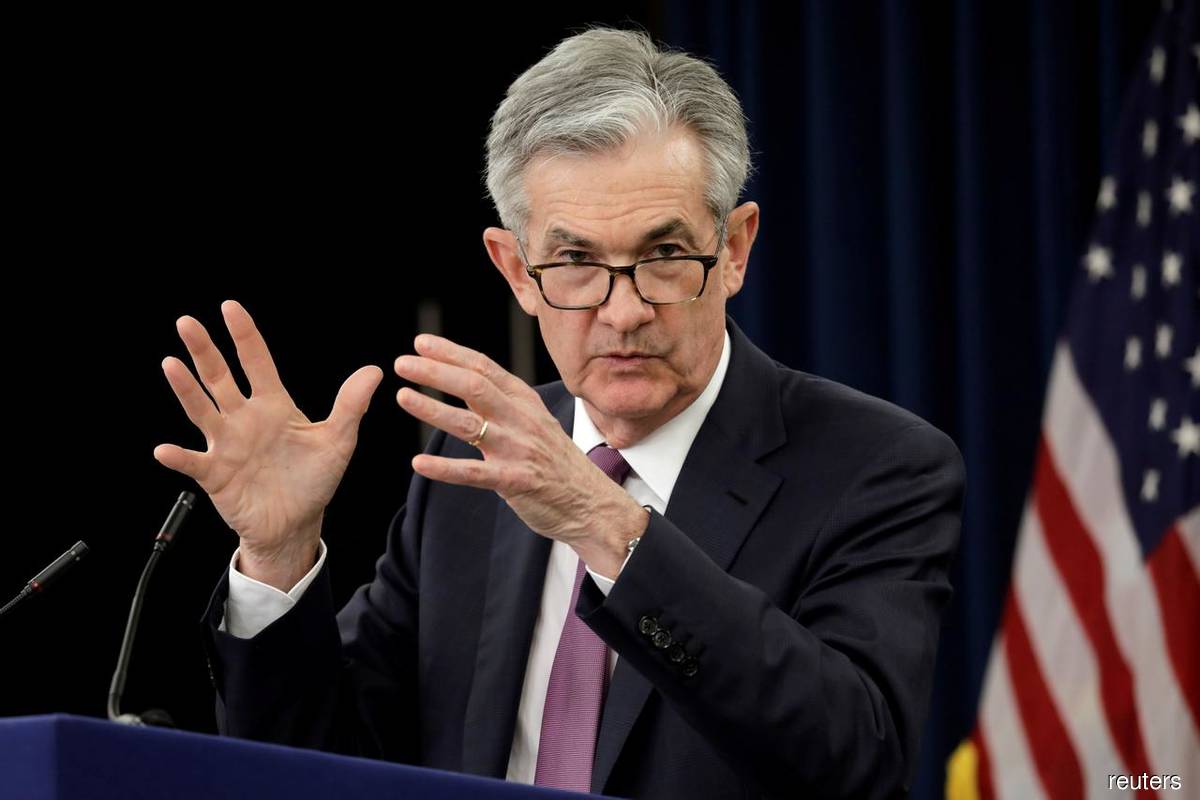Powell says economy can withstand Fed tightening, Omicron surge
