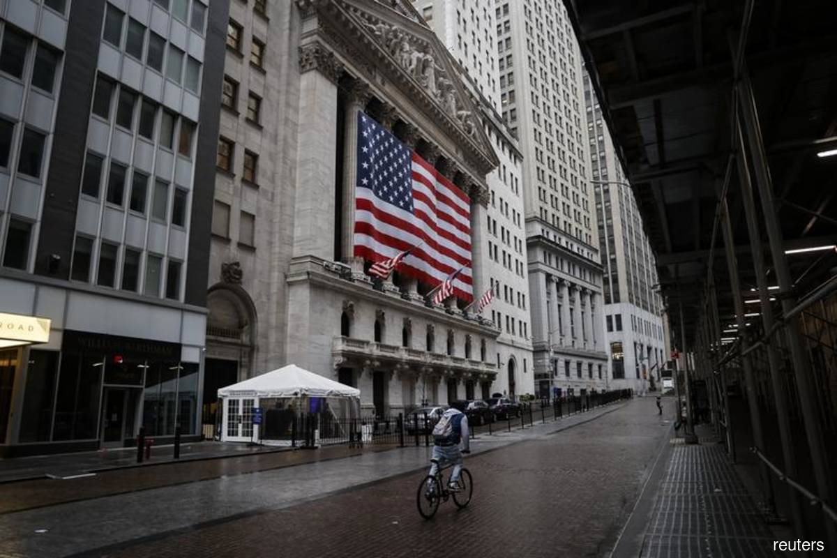 Wall Street pares losses on positive economic data, tech recovery