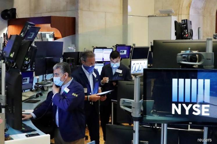 Wall Street closes down as late buying fails to overcome COVID concerns