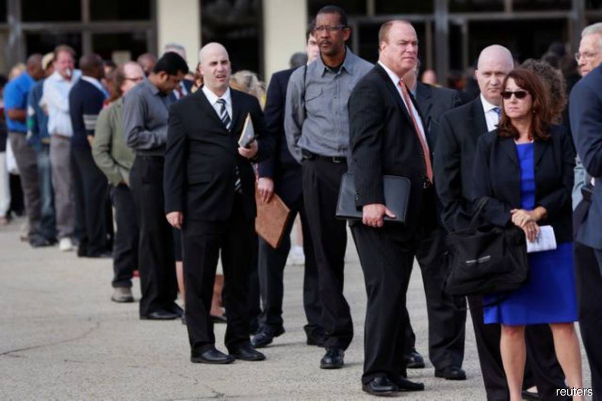 Spiraling Covid-19 cases driving up US layoffs; inflation still benign