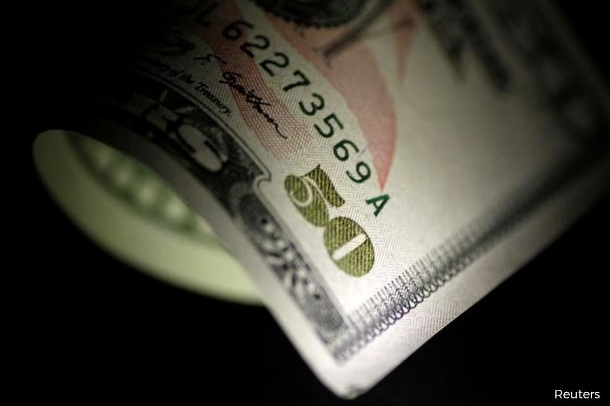 Dollar slips early against pound, kiwi looks to RBNZ